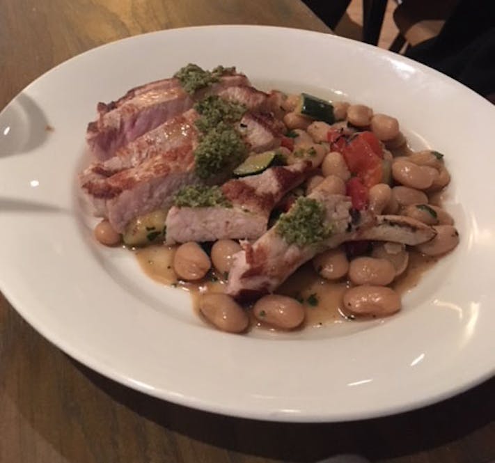 Pork chop with butterbeans and salsa verde