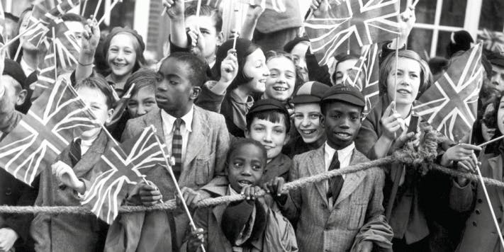 Crowds of children cheering Queen Mary as she opened a new extension of Lambeth Town Hall, Brixton, 14 October 1938. Photographer unknown. Copyright Topfoto.co.uk